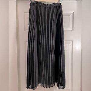 Black pleated midi skirt by CeCe. Size 14, brand new with tags, never been worn.